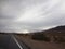 Afternoon Drive on a Stormy Desert Highway