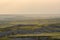 Afternoon Light Fades Over Badlands Formations