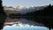 Afternoon pan of mt cook reflected in lake matheson