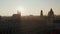 Afternoon Sun peeking behind Frauenkirche Cathedral Silhouette in beautiful Munich Cityscape Establishing Shot on a