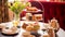 Afternoon tea, English tradition and restaurant service, tea cups, cakes, scones, sanwiches and desserts, holiday table decor and