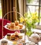 Afternoon tea, English tradition and restaurant service, tea cups, cakes, scones, sanwiches and desserts, holiday table decor and