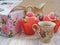 Afternoon tea served with a flower cupcakes and vintage teacup on shabby background