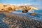 Afternoon view of breaking waves at the pebbly beach around Petra tou Romiou, also known as Aphrodite`s birthplace, in Paphos,