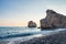 Afternoon view of breaking waves at the pebbly beach around Petra tou Romiou, also known as Aphrodite`s birthplace, in Paphos,