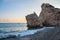 Afternoon view of breaking waves at the pebbly beach around Petra tou Romiou, also known as Aphrodite`s birthplace, in Paphos,