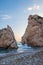 Afternoon view of breaking waves at the pebbly beach around Petra tou Romiou, also known as Aphrodite`s birthplace, in Paphos,