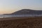 Agadir, Morocco beach with Moroccan motto on the mountain. Writing on the hillside meaning, God, Country, King. Evening