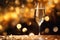 Against the background of confetti and lights, a glass of sparkling wine. Holiday concept