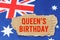 Against the background of the flag of Australia lies cardboard with the inscription - Queens Birthday