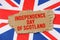 Against the background of the flag of Great Britain lies cardboard with the inscription - Independence Day of Scotland