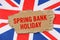 Against the background of the flag of Great Britain lies cardboard with the inscription - Spring Bank Holiday