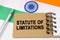 Against the background of the flag of India lies a notebook with the inscription - STATUTE OF LIMITATIONS