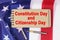 Against the background of the US flag lies cardboard with the inscription - Constitution Day and Citizenship Day