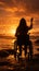 Against sunset over the ocean, wheelchair-bound womans silhouette raises arms gracefully