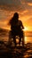 Against sunset over the ocean, wheelchair-bound womans silhouette raises arms gracefully