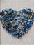 Agate blue crystals heart shape  closeup on elegant white