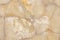 Agate gemstone shining translucent texture, gem quartz honey light yellow background