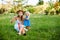 Age mother with a small daughter lying on the lawn in the park and blowing soap bubbles. Summer, vacation, maternity leave,