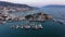 Agean sea landscape with ancient fortress and sailing boats in Turkey.