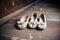 aged ballet slippers on a dusty wooden floor backstage