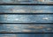 Aged blue wooden background. Planks with shriveled blue paint