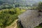 Aged Chinese farmhouse in flowering mountain on sunny spirng