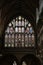 Aged church with an intricate stained glass window in Exeter Cathedral