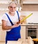 Aged contractor repairman working in the kitchen