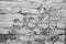 Aged cracked white brick wall background
