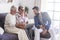 Aged family scene at home with mother father adult mature senior and son middle age with beard enjoy together the technology with