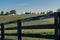 Aged Fence with Barn in Distance