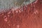 Aged grunge fiberglass texture painted red, grunge retro vintage texture background, aged grunge texture