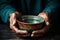 Aged hands cradle empty bowl, depicting the poignant concept of hunger and poverty