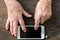 Aged hands using a mobile\'s touch screen