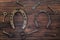 aged horseshoes, keys, scissors on wooden background