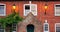 Aged house facade with two burning lantern