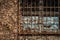 Aged latticed window of an old factory