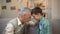 Aged male and boy touching foreheads, friendship between grandpa and grandson