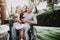 Aged Man with Girl. Girl with Bear on Stroller.