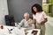 Aged man, senior intern looking at laptop while listening to his young colleague, Friendly female worker training or