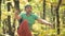 An aged man is trying to stand on a slackline sling to practice balance. The concept of physical development in