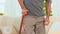 Aged man using a walking stick