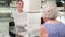 Aged married couple choosing new wedding rings at store