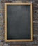 Aged menu blackboard hanging on brick wall