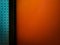 Aged metal door orange wall background, Orange empty interior with a straight rhombus in the door
