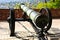 Aged old antique brass cannon barrel closeup in diminishing perspective