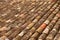 Aged old clay arabic roof tiles in rows