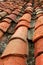 Aged old red clay arabic roof tiles