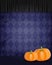 Aged old room with violet diamond-shaped grunge wallpaper, spider and pumpkins
